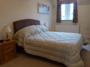 Second floor apartment master bedroom with king size bed